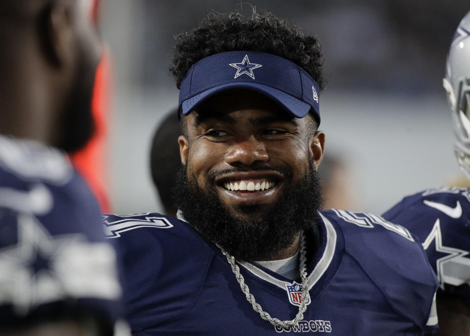 Ezekiel Elliott was banned six games by the NFL in a domestic violence case. (AP) 