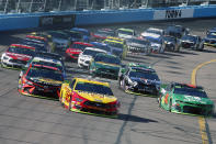 Joey Logano (22) leads the field through Turn 4 during a NASCAR Cup Series auto race at ISM Raceway, Sunday, Nov. 10, 2019, in Avondale, Ariz. (AP Photo/Ralph Freso)