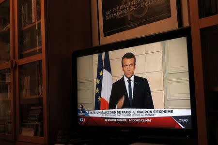 French President Emmanuel Macron, seen on all news channel LCI, speaks from the Elysee Palace in Paris, France, after U.S. President Donald Trump announced his decision that the United States will withdraw from the Paris Climate Agreement at a news conference, June 1, 2017. REUTERS/John Schults