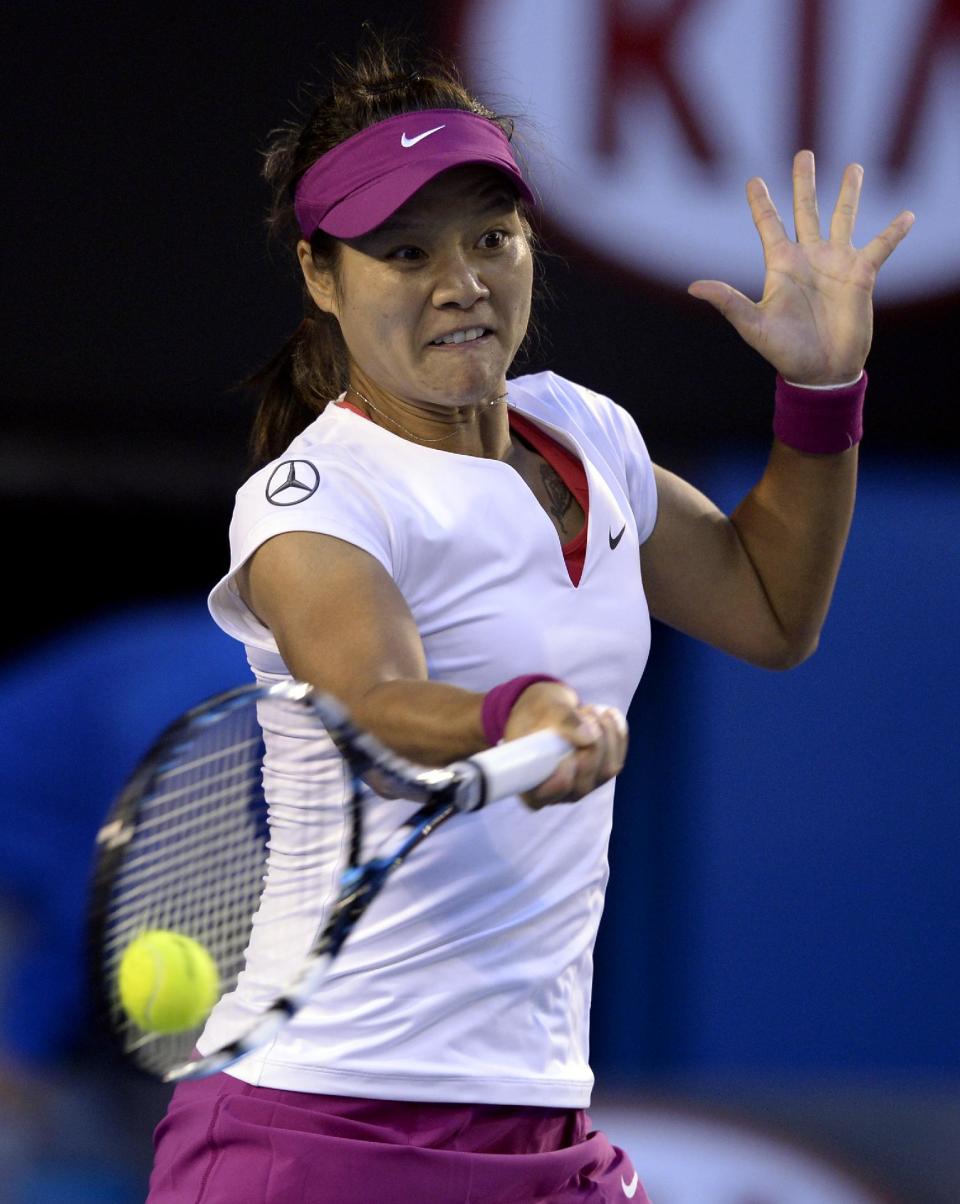 Li Na of China makes a forehand return to Dominika Cibulkova of Slovakia during their women's singles final at the Australian Open tennis championship in Melbourne, Australia, Saturday, Jan. 25, 2014.(AP Photo/Andrew Brownbill)