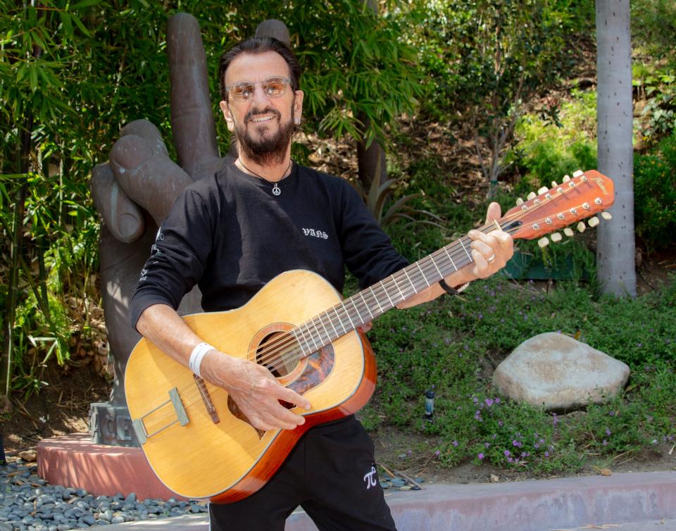 2023 Musicians Hall of Fame inductee Ringo Starr photographed with John Lennon's Framus 12-string Hootenanny acoustic guitar
