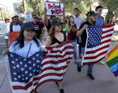 <p>Deferred Action for Childhood Arrivals (DACA) supporters march to the Immigration and Customs Enforcement office to protest shortly after U.S. Attorney General Jeff Sessions’ announcement that the Deferred Action for Childhood Arrivals (DACA), will be suspended with a six-month delay, Tuesday, Sept. 5, 2017, in Phoenix. (Photo: Matt York/AP) </p>