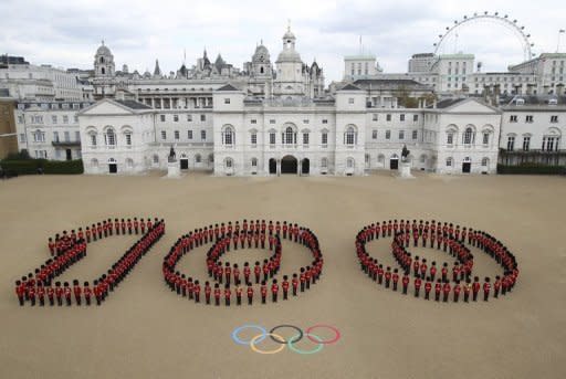 A picture released by the London Organising Committee of the Olympic and Paralympic Games (LOCOG) shows 260 guardsmen from the Grenadier, Coldstream, Scots and Welsh Guards forming a giant "100" at Horse Guards Parade in London to mark 100 days to go until the 2012 London Olympic Games