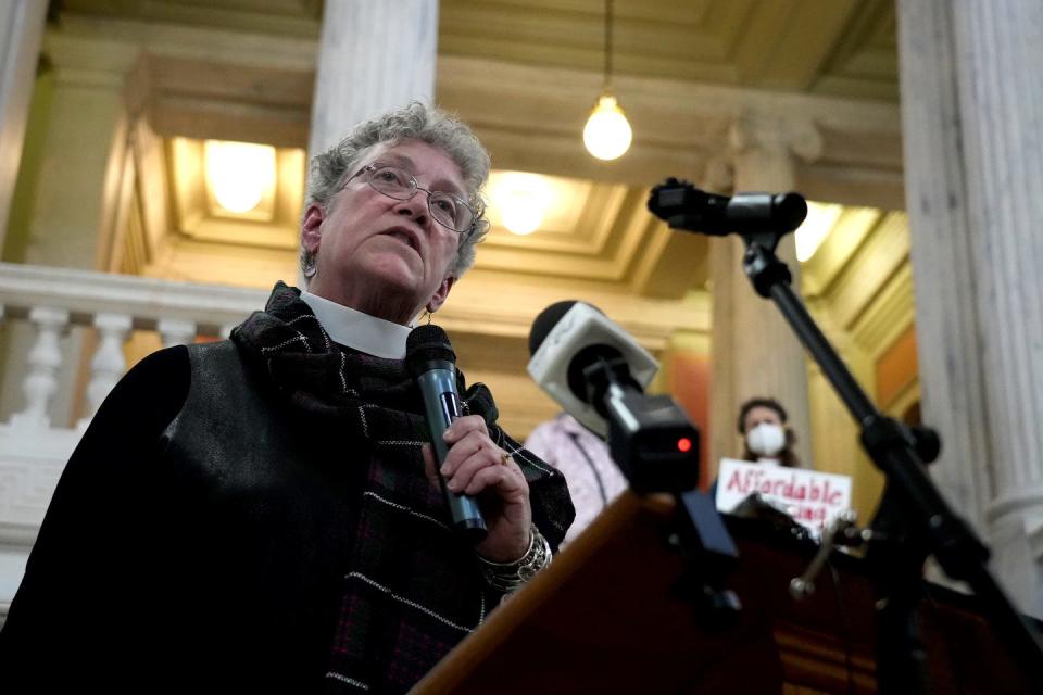 Archdeacon Grace Swinski of the Episcopal Diocese of Rhode Island urges lawmakers to help the homeless at the 15th annual vigil by the RI Interfaith Coalition to Reduce Poverty, which was held Wednesday in the State House rotunda.