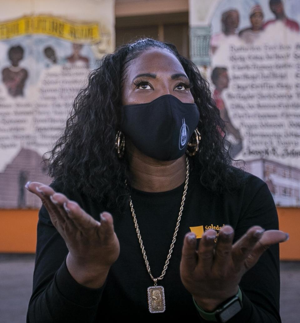 Chica Caldwell speaks outside Nickerson Gardens.