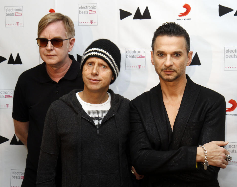 FILE - This March 24, 2013 file photo shows, from left, Andrew Fletcher, Martin Gore and Dave Gahan, from Depeche Mode at the Depeche Mode Delta Machine Album launch in Vienna, Austria. Depeche Mode's dark, electronic grooves are all over "Delta Machine," the trio's 13th release, out this week. (AP Photo/Ronald Zak, file)