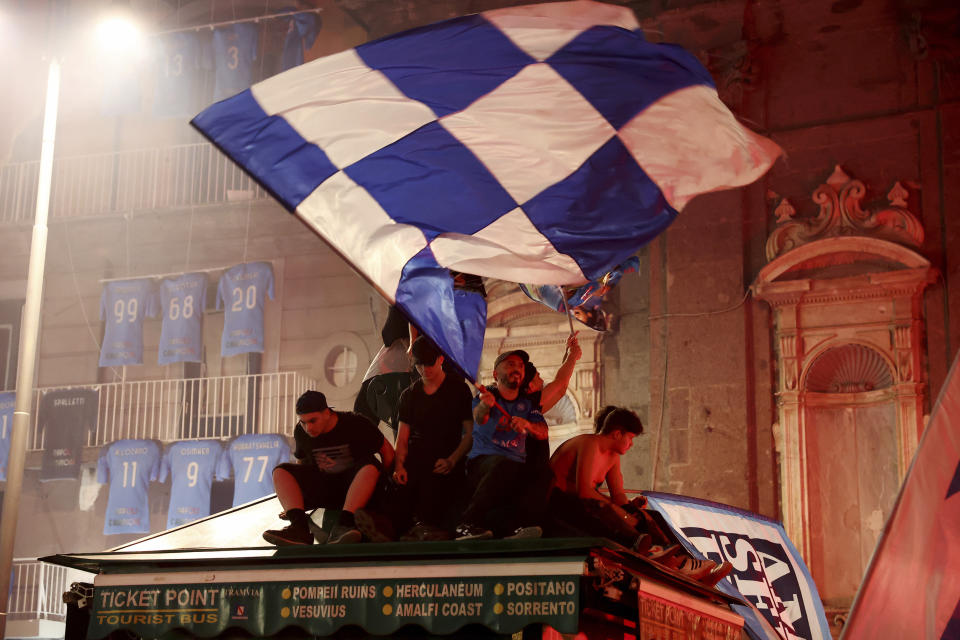 Napoli fans celebrate Thursday May 4, 2023, in Naples, Italy, after their soccer team won the Serie A soccer. The southern team sealed the trophy with a 1-1 draw at Udinese. (Alessandro Garofalo/LaPresse via AP)