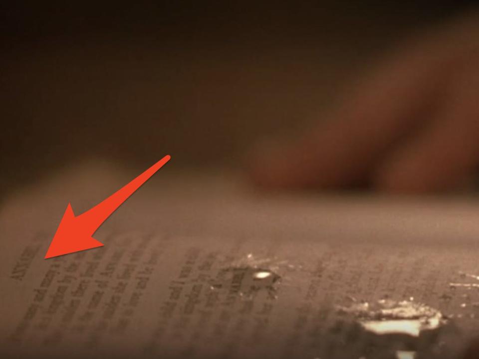 arrow pointing at title of annabell lee in a book in a scene from holes