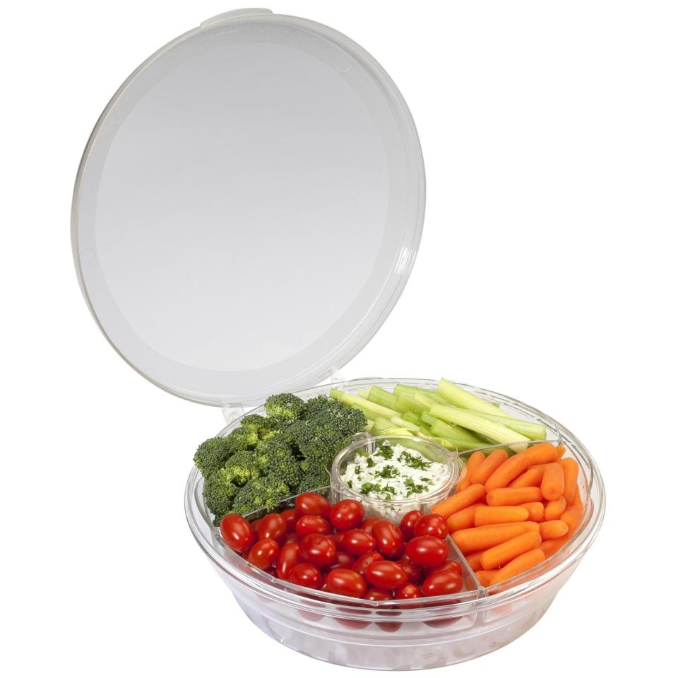 An appetizer server filled with vegetables and dip