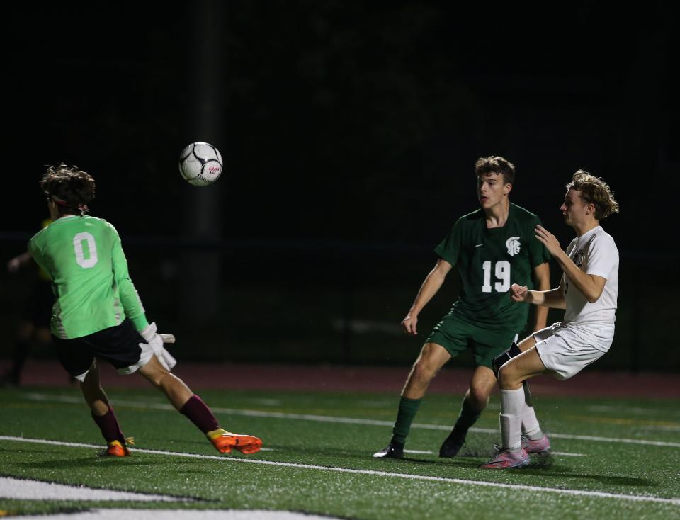 Spackenkill's Dylan Updyke shoots to score on O'Neill's Lucas Haley during Thursday's Section 9 Class B semifinal on October 26, 2023.