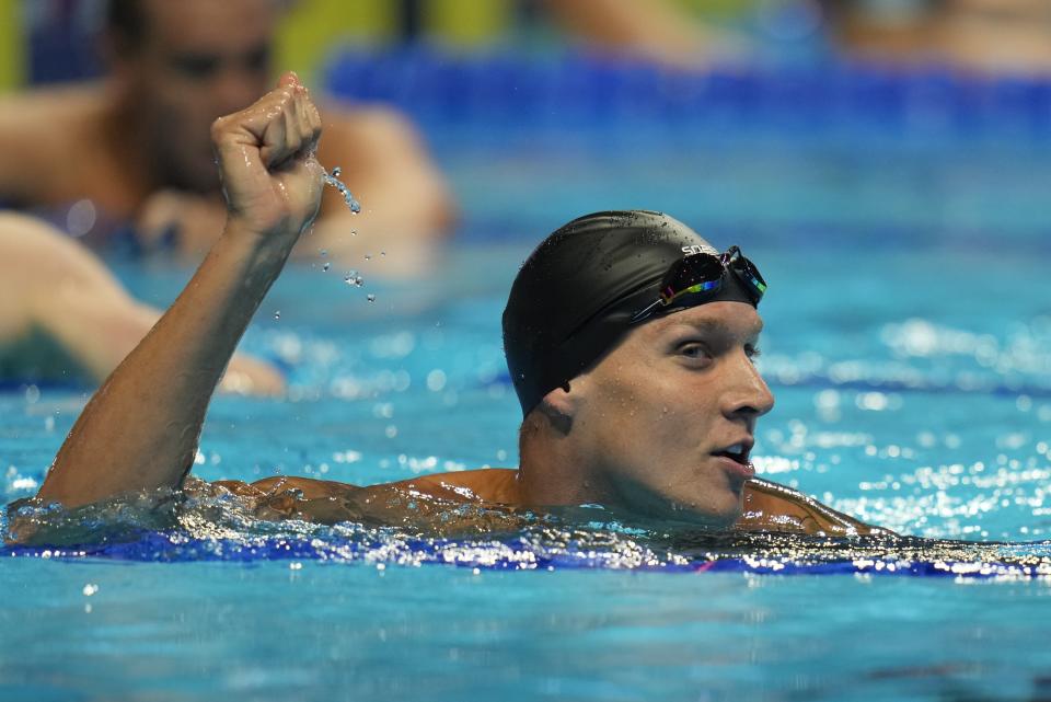 Caeleb Dressel reacts after winning the men's 100 butterfly during wave 2 of the U.S. Olympic Swim Trials on Saturday, June 19, 2021, in Omaha, Neb. (AP Photo/Jeff Roberson)