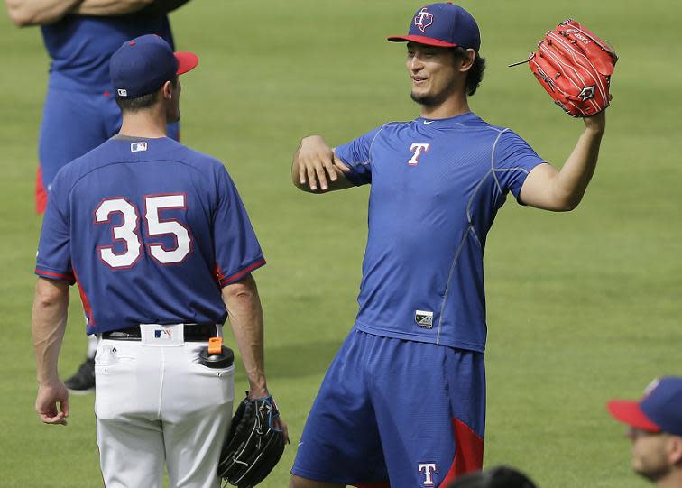 Yu Darvish, (right) and Cole Hamels are ready to lead Texas into the postseason. (AP)