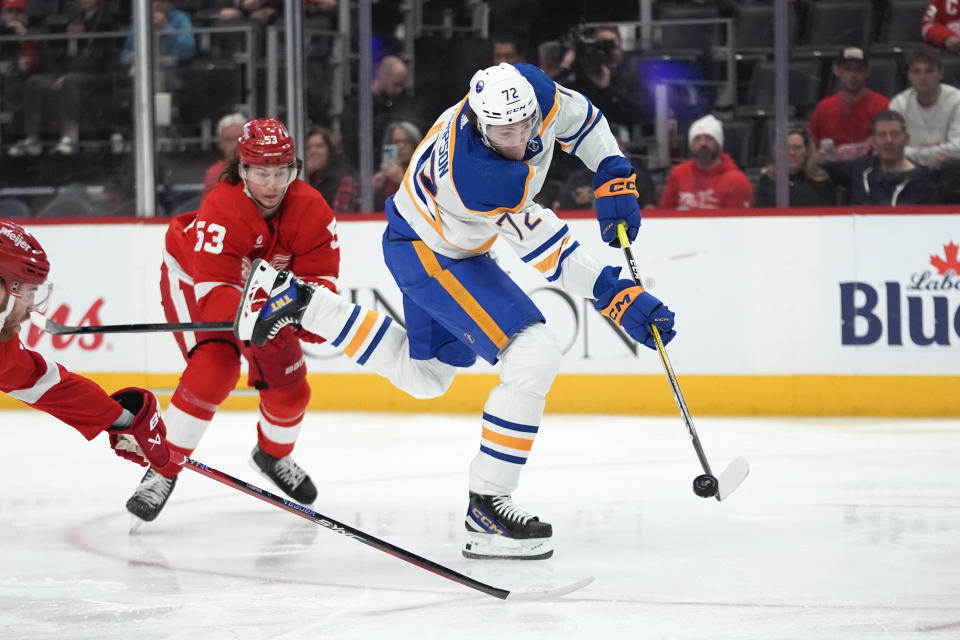 Buffalo Sabres right wing Tage Thompson (72) shoots as Detroit Red Wings' Moritz Seider (53) defends in the second period of an NHL hockey game Saturday, March 16, 2024, in Detroit. (AP Photo/Paul Sancya)