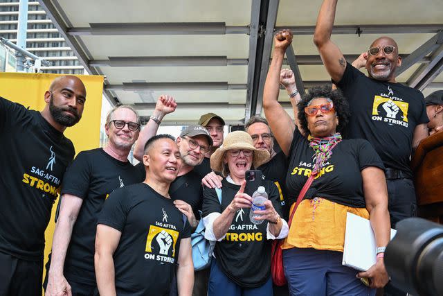 Alexi Rosenfeld/Getty Steve Buscemi, BD Wong, Christian Slater, Brendan Fraser, Bryan Cranston, Nancy Giles and Ezra Knight are seen on stage during the "Rock The City For A Fair Contract" rally in Times Square on July 25, 2023 in NYC.