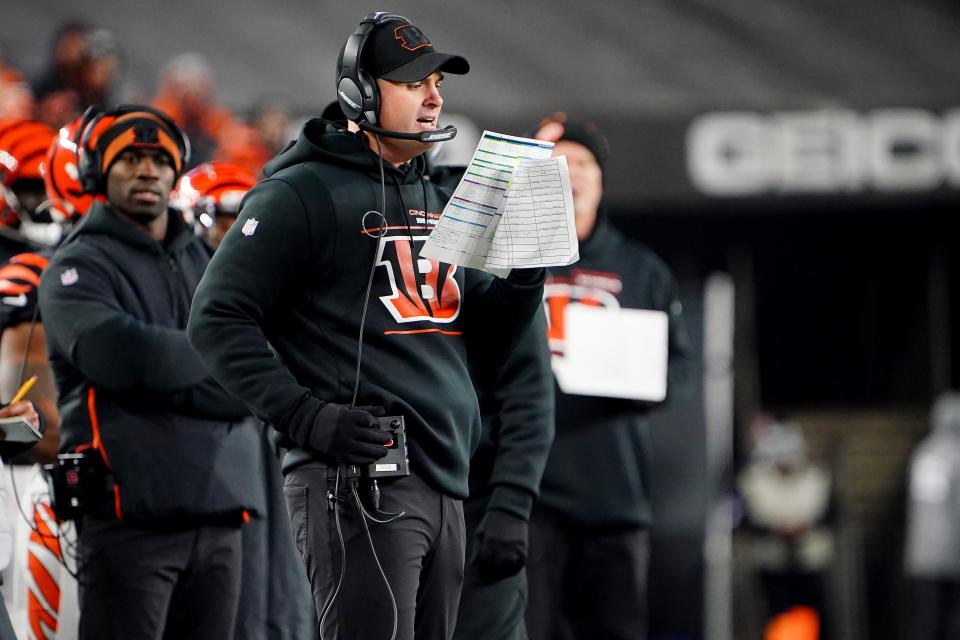 Cincinnati Bengals head coach Zac Taylor calls a play in the fourtg quarter during an NFL AFC wild-card playoff game against the Las Vegas Raiders, Saturday, Jan. 15, 2022, at Paul Brown Stadium in Cincinnati. The Cincinnati Bengals defeated the Las Vegas Raiders, 26-19. to win the franchise's first playoff game in 30 years.