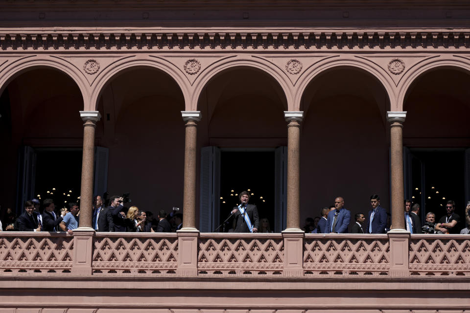 Argentina's newly sworn-in President Javier Milei addresses supporters from the balcony of the government house in Buenos Aires, Argentina, Sunday, Dec. 10, 2023. (AP Photo/Matilde Campodonico)