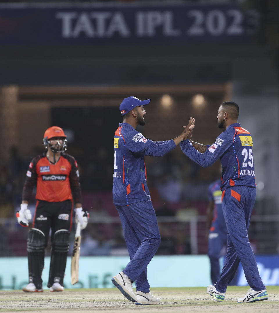Krunal Pandya of Lucknow Super Giants ,right, celebrate the wicket of Anmolpreet Singh of Sunrisers Hyderabad with captain K.L.Rahul during the Indian Premier League cricket match, in Lucknow, India, Friday, April 7, 2023. (AP Photo/Surjeet Yadav)