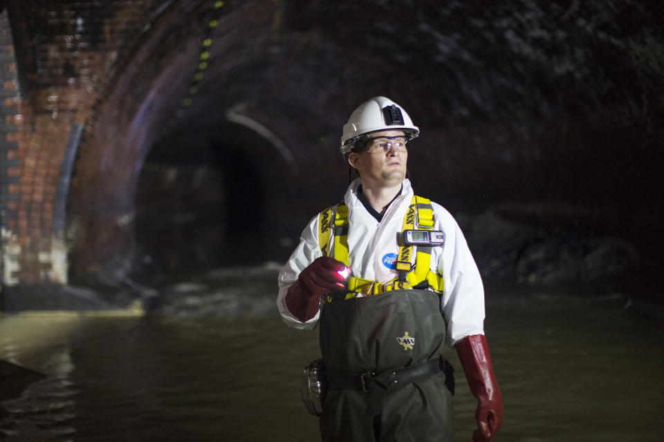 Image: An operations manager inside a sewer in London. (Jack Taylor / Getty Images file)