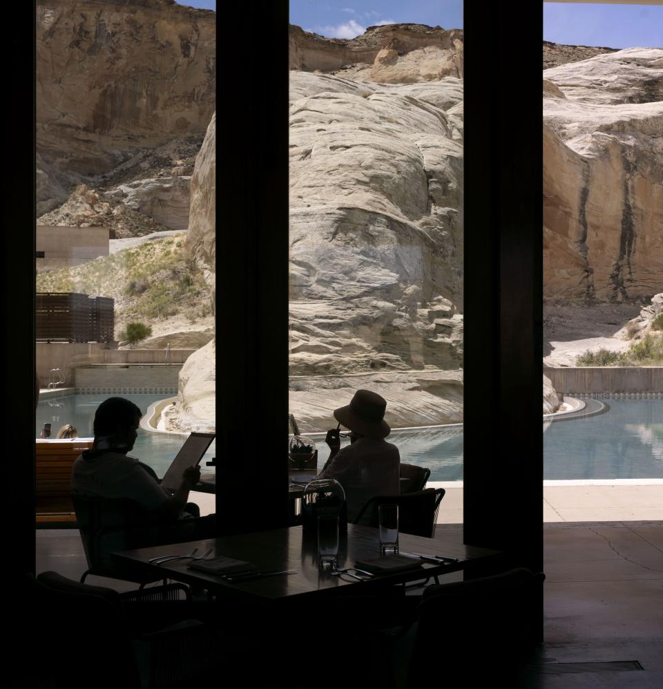 Guests sit at the swimming pool at Amangiri located in Canyon Point, Utah, on Wednesday, May 17, 2023. | Laura Seitz, Deseret News