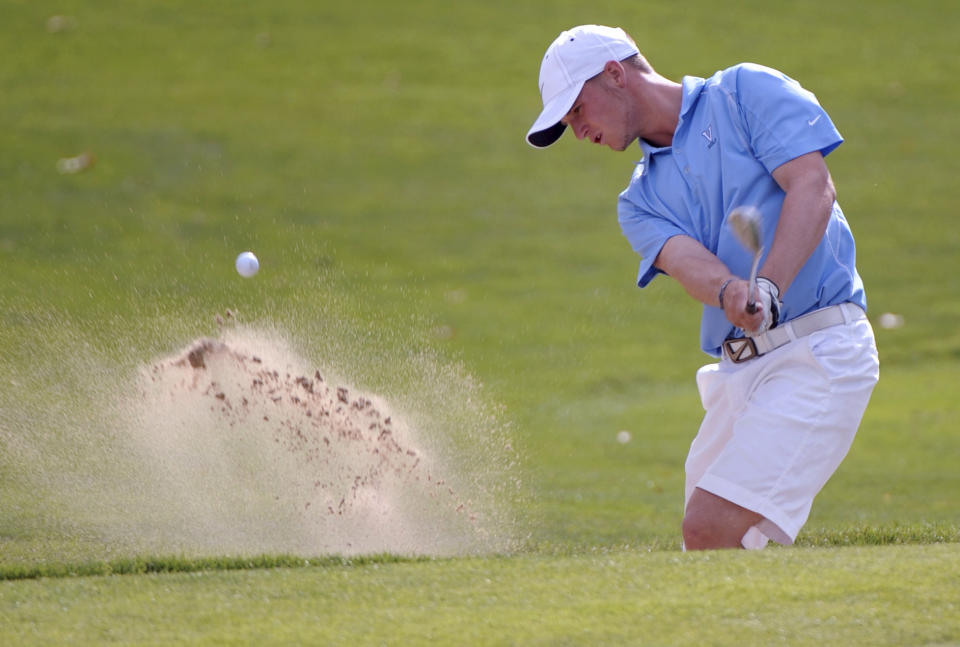 FILE - Valor Christian High School's Wyndham Clark chips from the sand onto the 18th green during the 4A Colorado High School state boys golf championship at Pelican Lakes Golf Club in Windsor, Colo., Tuesday, Oct. 4, 2011. Wyndham Clark won the U.S. Open on Father's Day, but he'd be the first to tell people that this win was really for his mom. (RJ Sangosti/The Denver Post via AP, File)