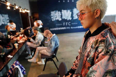 FILE PHOTO: Members of China's all-girl "boyband" FFC-Acrush prepare for the band's maiden press conference in Beijing, China April 28, 2017. REUTERS/Damir Sagolj/File Photo