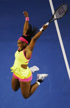 Serena Williams of the U.S. celebrates after defeating Maria Sharapova of Russia in their women's singles final match at the Australian Open 2015 tennis tournament in Melbourne January 31, 2015. REUTERS/Carlos Barria
