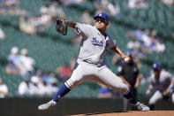 Los Angeles Dodgers starting pitcher Julio Urias throws against the Seattle Mariners in the first inning of a baseball game Tuesday, April 20, 2021, in Seattle. (AP Photo/Ted S. Warren)