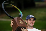 Patrick Cantlay poses with his trophy after winning the Zozo Championship golf tournament Sunday, Oct. 25, 2020, in Thousand Oaks, Calif. (AP Photo/Ringo H.W. Chiu)