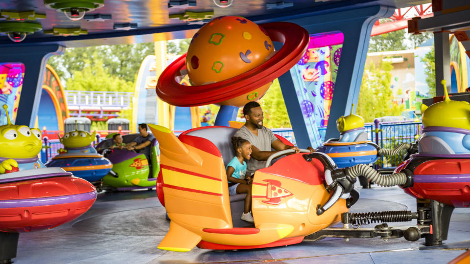 Visitors board toy rockets on&nbsp;the saucers ride. Inspiration for the attraction came from the play set Andy won at Pizza Planet in the film franchise.