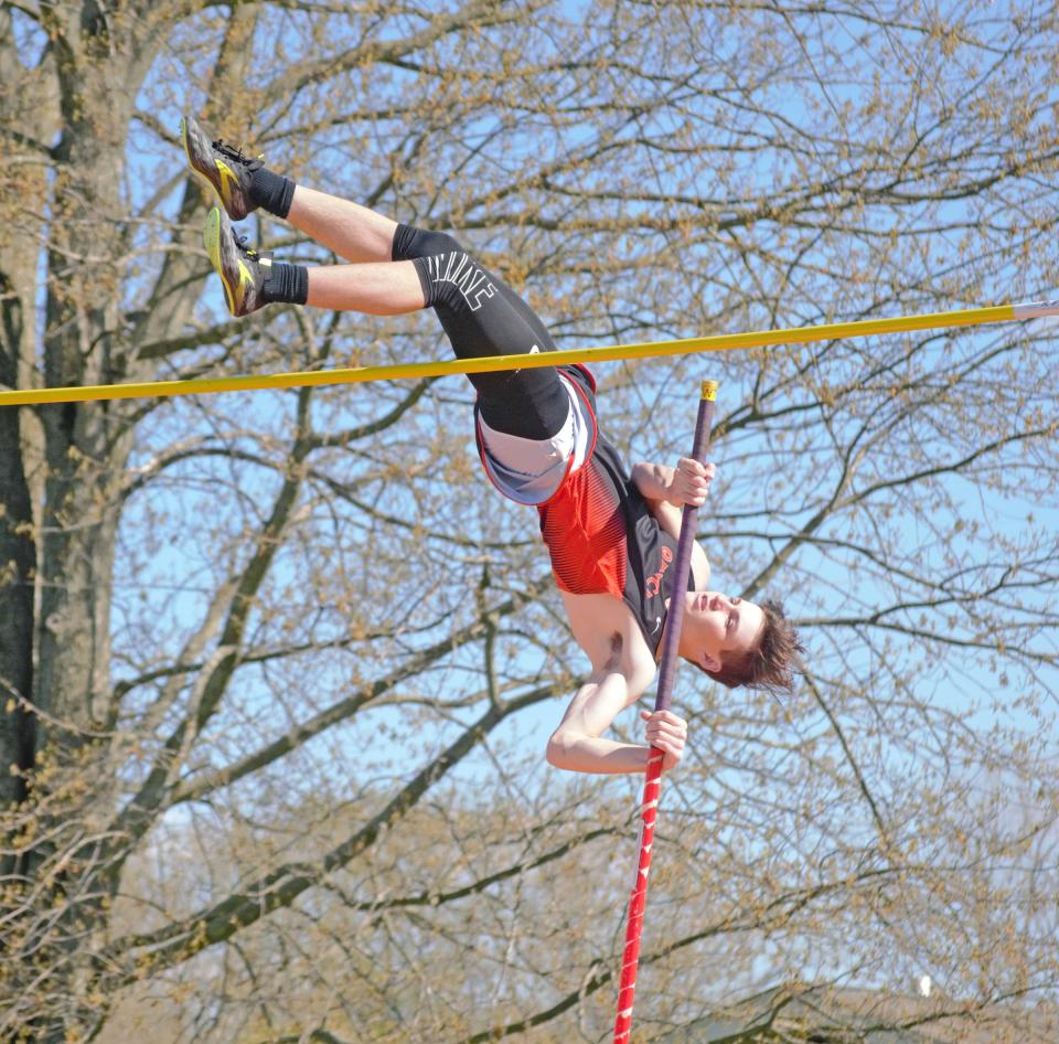 Quincy's Corey Turner clears a personal best 12'3" in the pole vault Wednesday versus Union City and Springport