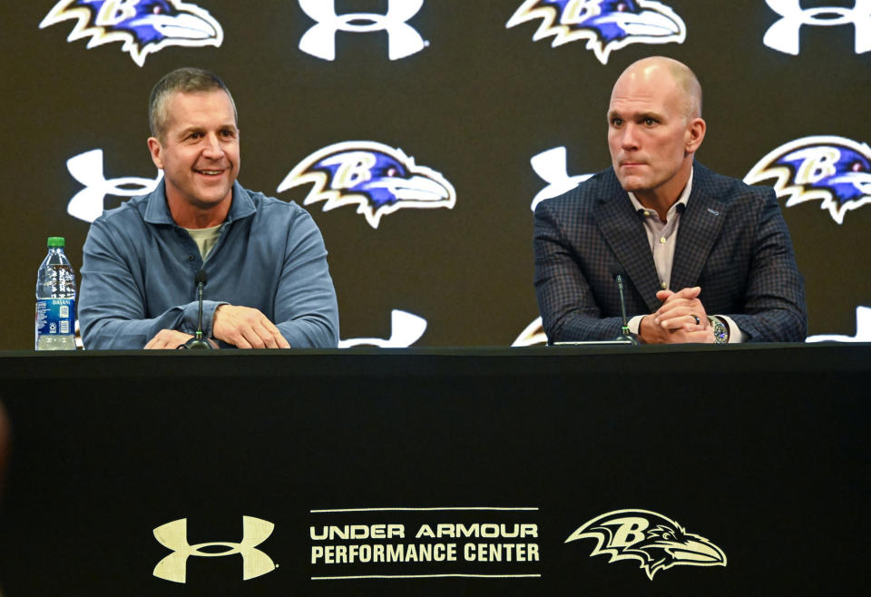 Ravens head coach John Harbaugh (left) and general manager Eric DeCosta hope they'll be celebrating a Super Bowl title with their big-money quarterback, and not regretting the extension in a couple years. (Kevin Richardson/The Baltimore Sun/Tribune News Service via Getty Images)