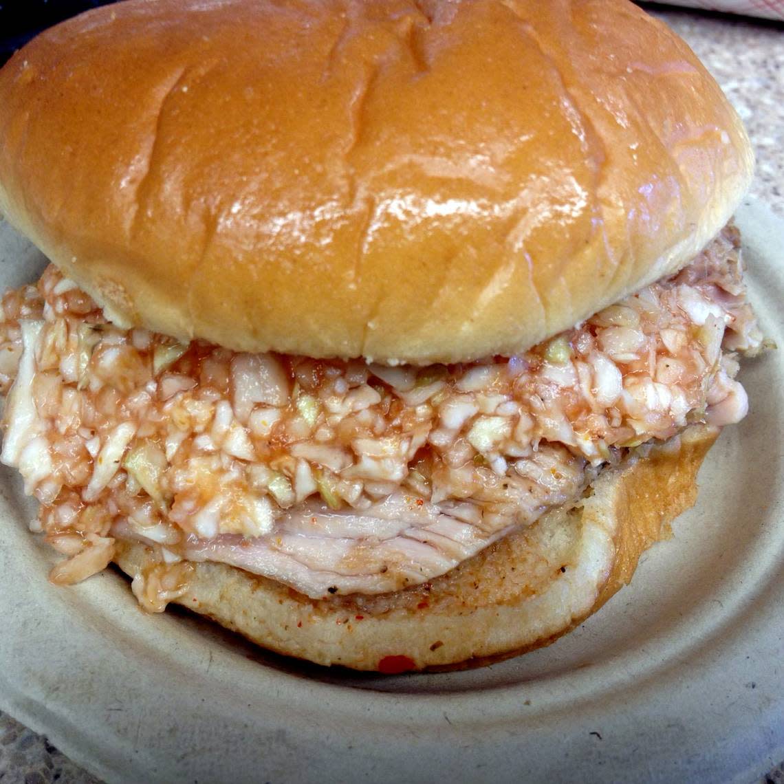 A barbecue sandwich at Lexington Barbecue features pork shoulder and red slaw.