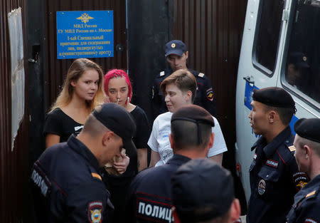 Intruders affiliated to anti-Kremlin punk band Pussy Riot, Veronika Nikulshina, Olga Kurachyova and Olga Pakhtusova, who ran onto the pitch during the World Cup final between France and Croatia, walk out of a detention center after leaving 15-day jail in Moscow, Russia July 30, 2018. REUTERS/Maxim Shemetov