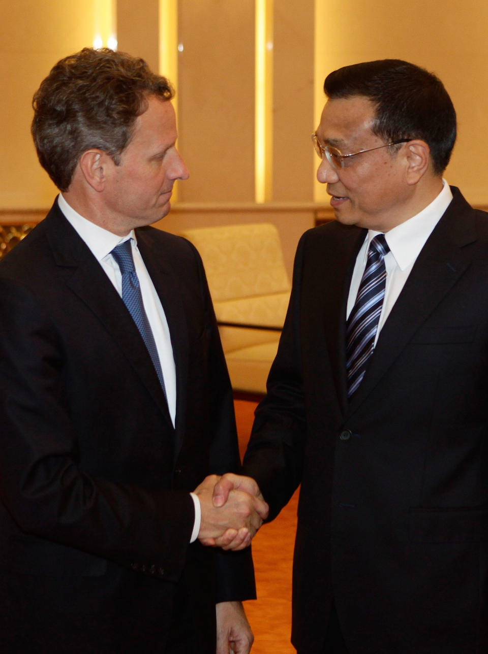 BEIJING, CHINA - MAY 3: U.S. Treasury Secretary Timothy Geithner (L) shakes hands with China's Vice Premier Li Keqiang during a meeting at the Great Hall of the People on May 4, 2012 in Beijing. Hillary Clinton is in China for bilateral talks and has called on China to protect human rights. (Photo by Jason Lee/Pool/Getty Images)