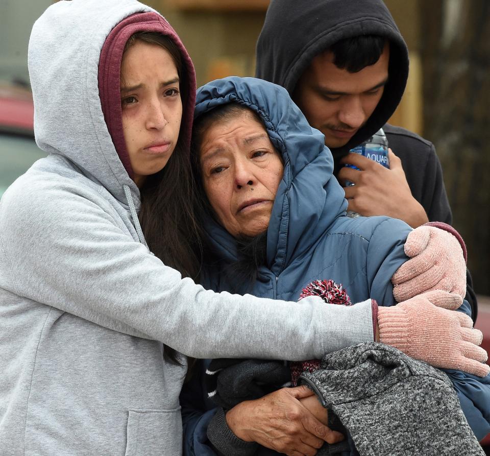 <p>Family members mourn at the scene where their loved ones were killed in Colorado Springs</p> (AP)