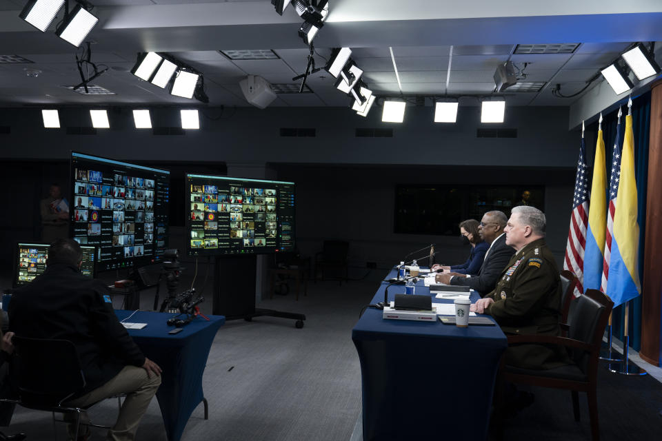 FILE - Secretary of Defense Lloyd Austin, center, gives opening remarks accompanied by Joint Chiefs Chairman Gen. Mark Milley, right, and Deputy Assistant Secretary of Defense for Russia, Ukraine, Eurasia, Laura Cooper, at a virtual meeting of the Ukraine Defense Contact Group at the Pentagon, Monday, May 23, 2022, in Washington. (AP Photo/Alex Brandon, File)