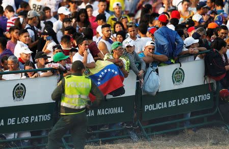 People attend the "Venezuela Aid Live" concert near the Tienditas cross-border bridge between Colombia and Venezuela, in Cucuta, Colombia, February 22, 2019. REUTERS/Luisa Gonzalez