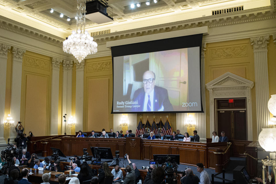 A video of Rudy Giuliani is displayed as the House select committee investigating the Jan. 6 attack on the U.S. Capitol continues to reveal its findings of a year-long investigation, at the Capitol in Washington, Tuesday, June 21, 2022. (Al Drago/Pool Photo via AP)