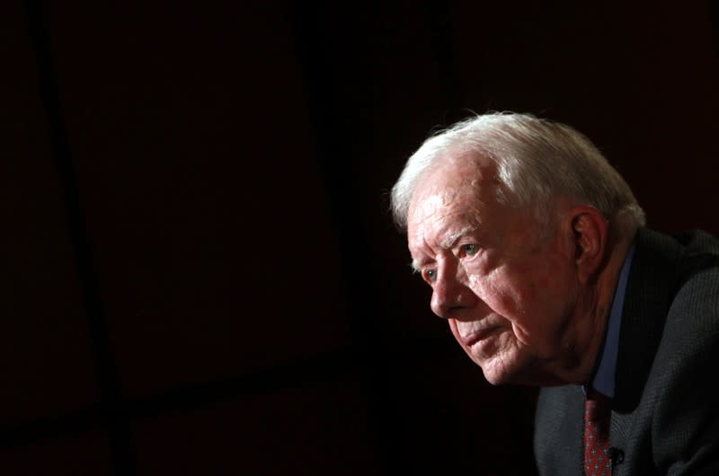 FILE PHOTO: Former U.S. President Jimmy Carter attends an interview with Reuters in Cairo