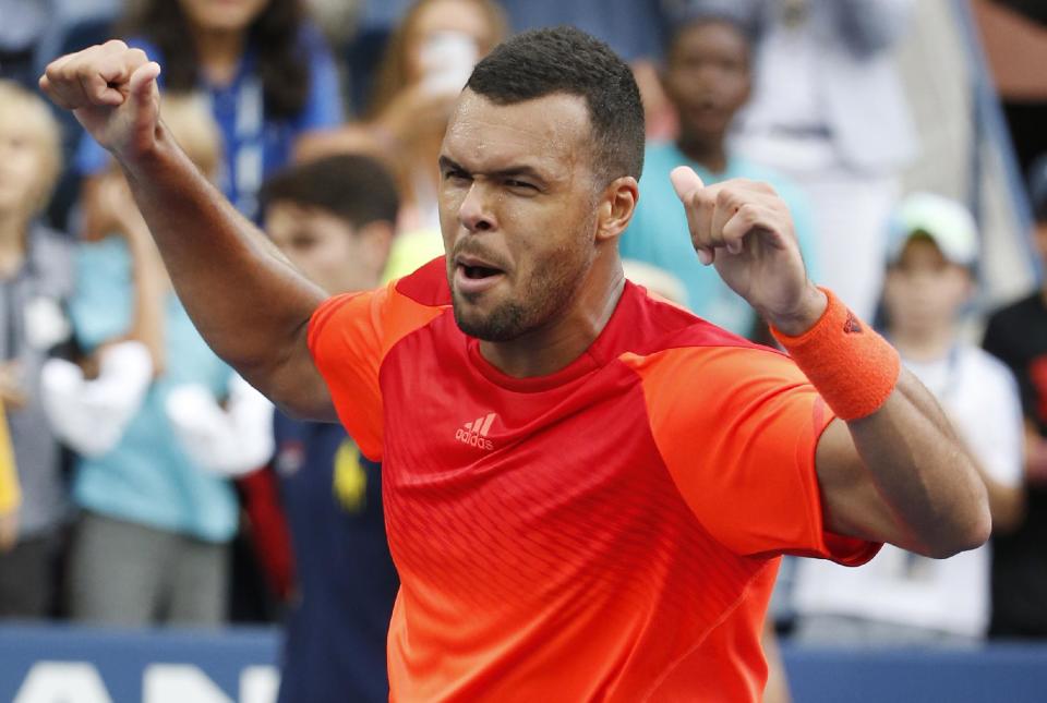 Jo-Wilifried Tsonga, of France, reacts after defeating Pablo Carreno Busta, of Spain, during the third round of the U.S. Open. (AP Photo/Kathy Willens)