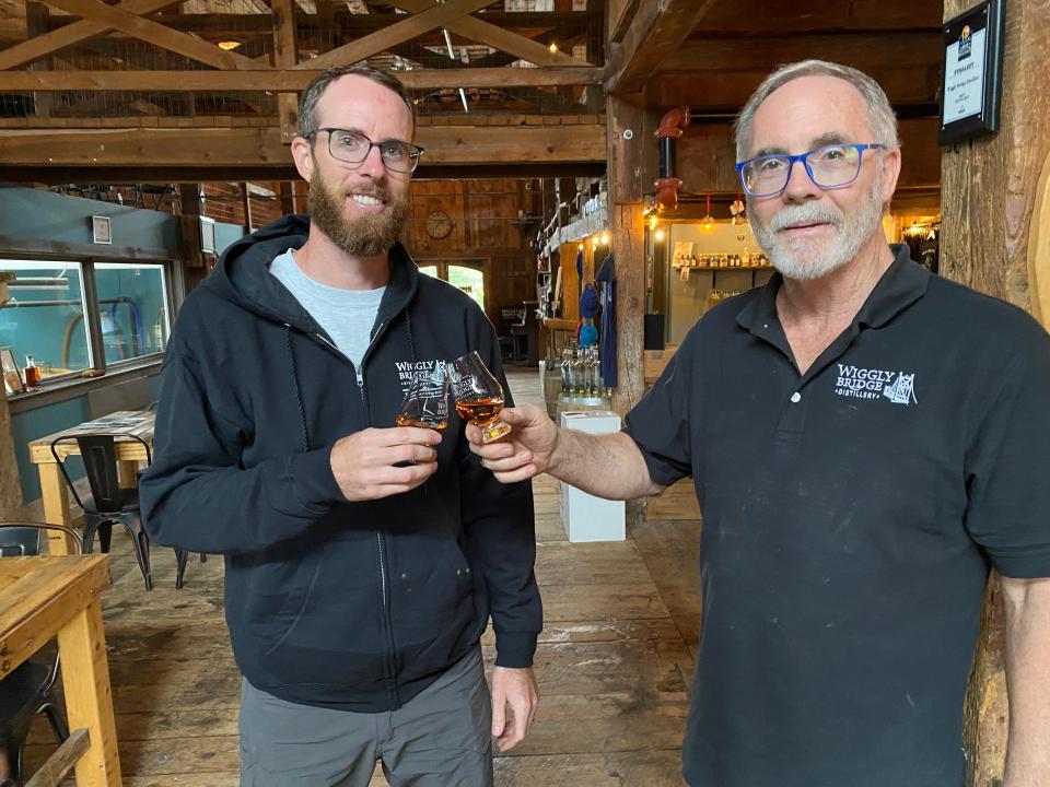 David Woods II, left, and his father David Woods plan to expand their Wiggly Bridge Distillery after 10 years in business on Route 1 in York, Maine.