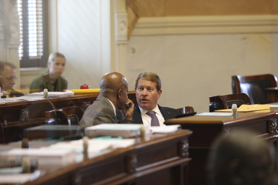 South Carolina Sen. Shane Martin, R-Pauline, right, talks to Sen. Ronnie Sabb, D-Greeleyville, left before the Senate started debating a bill that would ban gender-affirming care for transgender minors on Wednesday, May 1, 2024, in Columbia, S.C. (AP Photo/Jeffrey Collins)