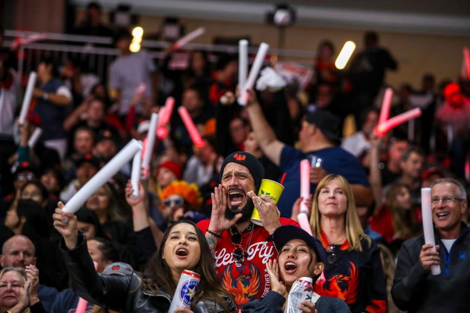 Coachella Valley Firebirds fans cheer for their team during the third period of Game 7 of the Calder Cup Finals at Acrisure Arena in Palm Desert, Calif., Wednesday, June 21, 2023. 