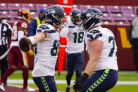 Seattle Seahawks tight end Jacob Hollister (86) celebrating his touchdown with teammate Seattle Seahawks center Ethan Pocic (77) during the first half of an NFL football game against the Washington Football Team, Sunday, Dec. 20, 2020, in Landover, Md. (AP Photo/Andrew Harnik)