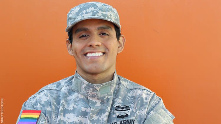 Image of an out solider with a Pride flag on uniform