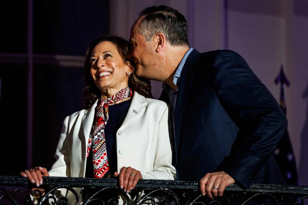 The pair whisper to each other while watching the fireworks from the White House balcony on July 4, 2024 (Getty Images)