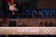<p>TOPSHOT - China's Tang Xijing competes in the artistic gymnastics women's balance beam final of the Tokyo 2020 Olympic Games at Ariake Gymnastics Centre in Tokyo on August 3, 2021. (Photo by Jeff PACHOUD / AFP) (Photo by JEFF PACHOUD/AFP via Getty Images)</p> 