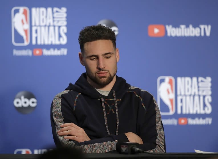 Golden State Warriors' Klay Thompson waits to speak during a media conference after Game 4 of basketball's NBA Finals against the Toronto Raptors Friday, June 7, 2019, in Oakland, Calif. (AP Photo/Ben Margot)