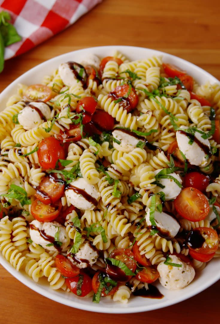 <p>This balsamic drizzle is almost too good.</p><p>Get the recipe from <a href="https://www.delish.com/cooking/recipe-ideas/recipes/a53227/caprese-pasta-salad-recipe/" rel="nofollow noopener" target="_blank" data-ylk="slk:Delish;elm:context_link;itc:0;sec:content-canvas" class="link ">Delish</a>.</p>