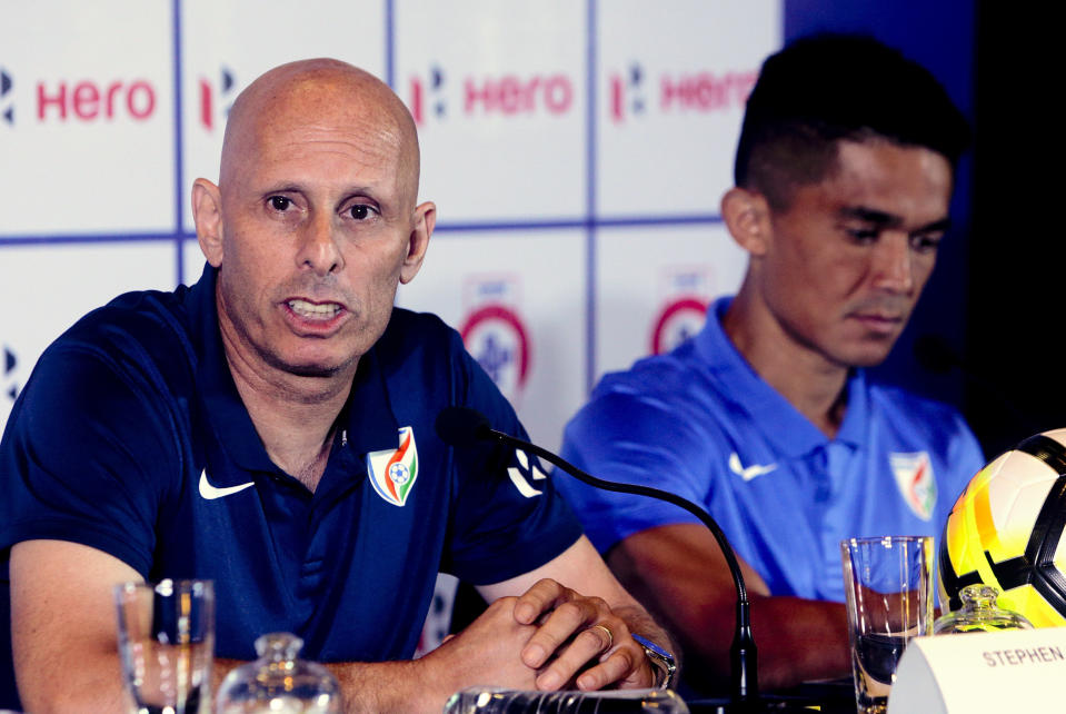 FILE - In this May 31, 2018, file photo, India's soccer coach Stephen Constantine speaks with captain Sunil Chhetri by his side during a pre-tournament press conference for the Hero Intercontinental Cup in Mumbai, India. Soccer’s two biggest sleeping giants India and China meet in Suzhou, China on Saturday, Oct. 13, for the first time since 1997. Representing around one-third of the world’s population, India and China both show signs of growing strength in their domestic leagues, despite limited international success. (AP Photo/Rajanish Kakade, File)